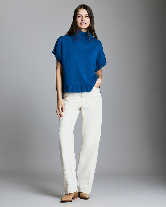 Model wears the funnel shell sweater