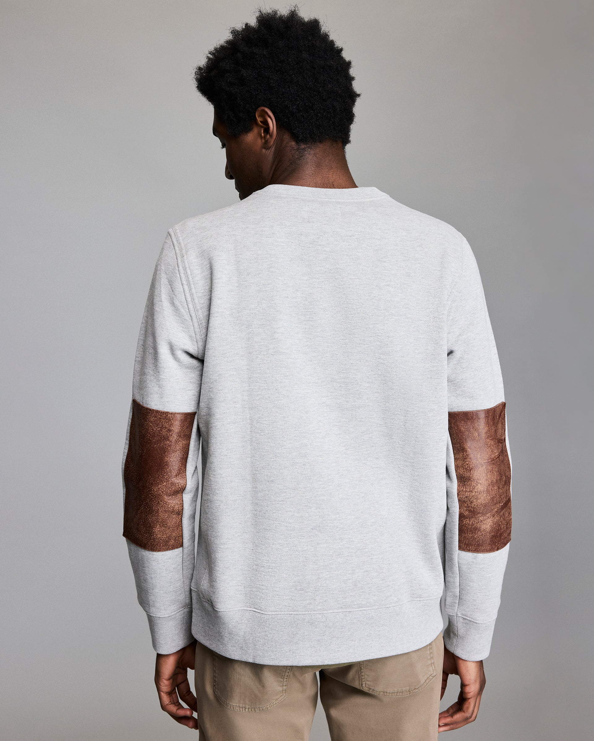 Back of the sweatshirt, showing off the leather elbow patches.