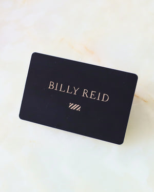 Black card with 'BILLY REID' printed on it against a light background
