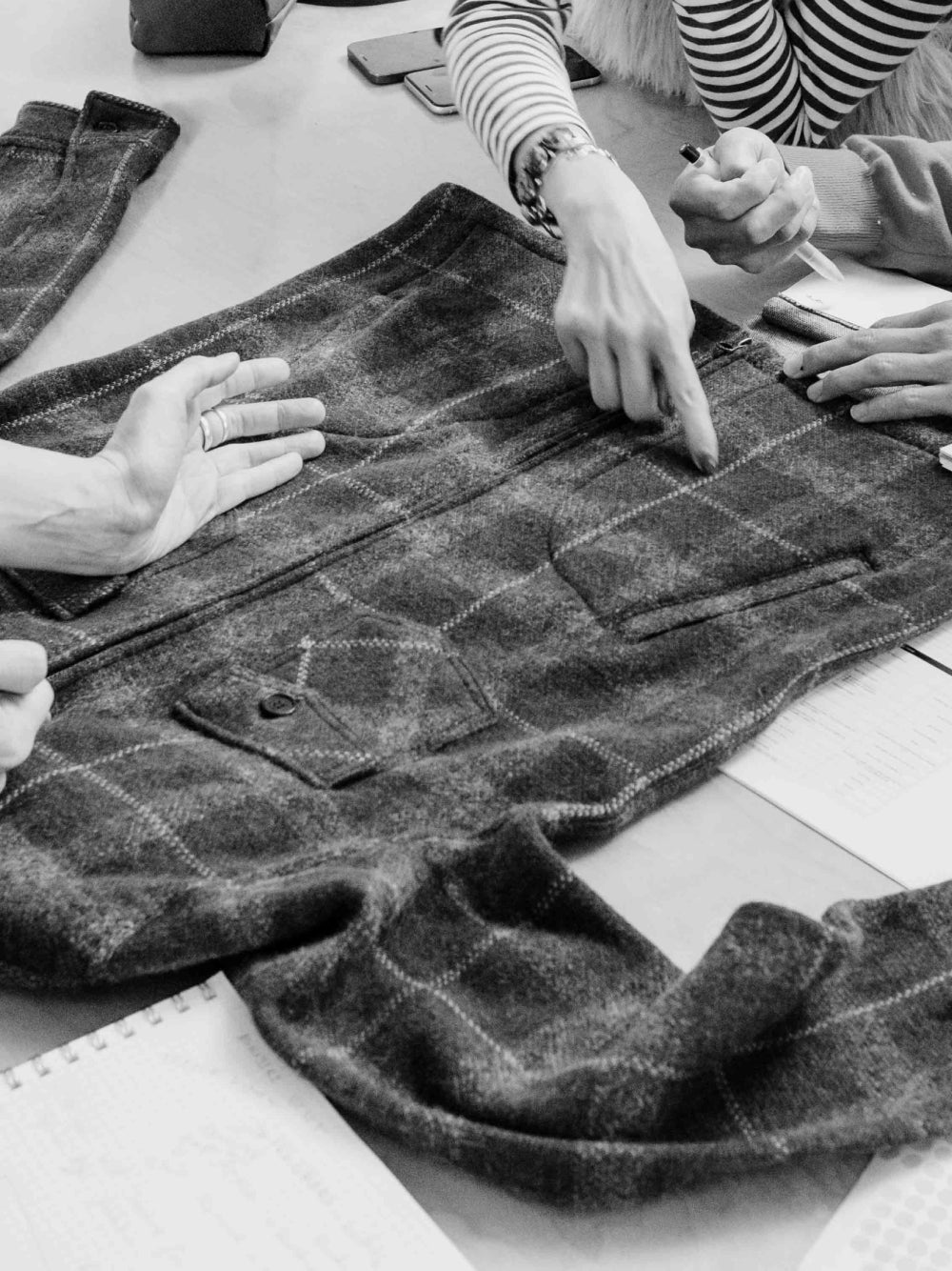 Designers work over a jacket.