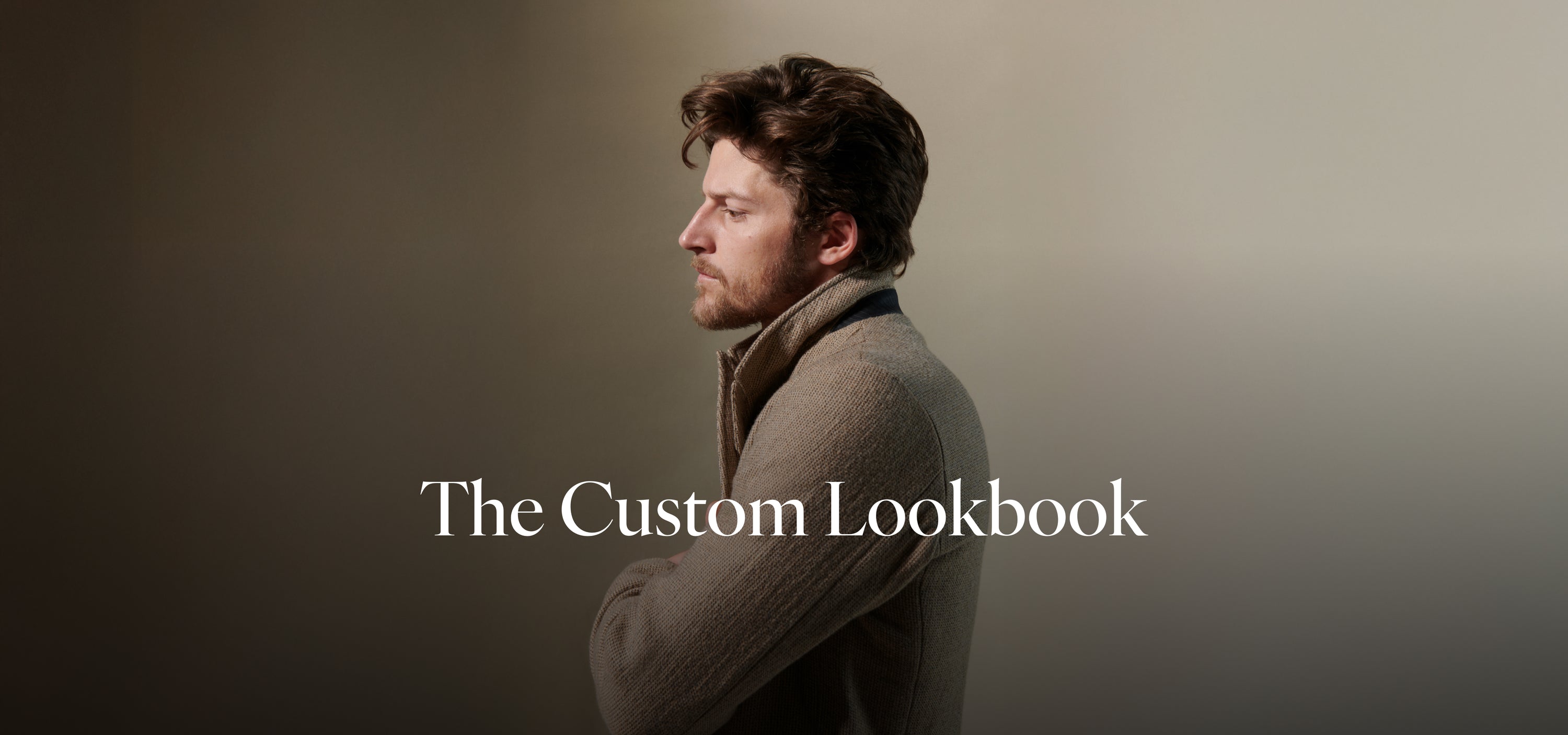 Man in a coat with 'The Custom Lookbook' text on a plain background