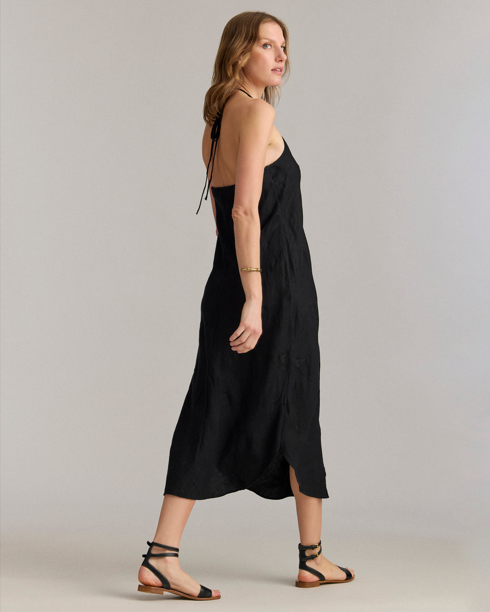 Back view of the dress shows off the low-back cut.