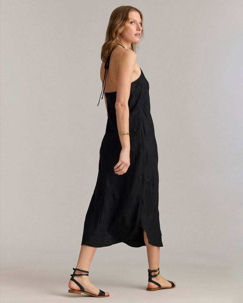 Back view of the dress shows off the low-back cut.