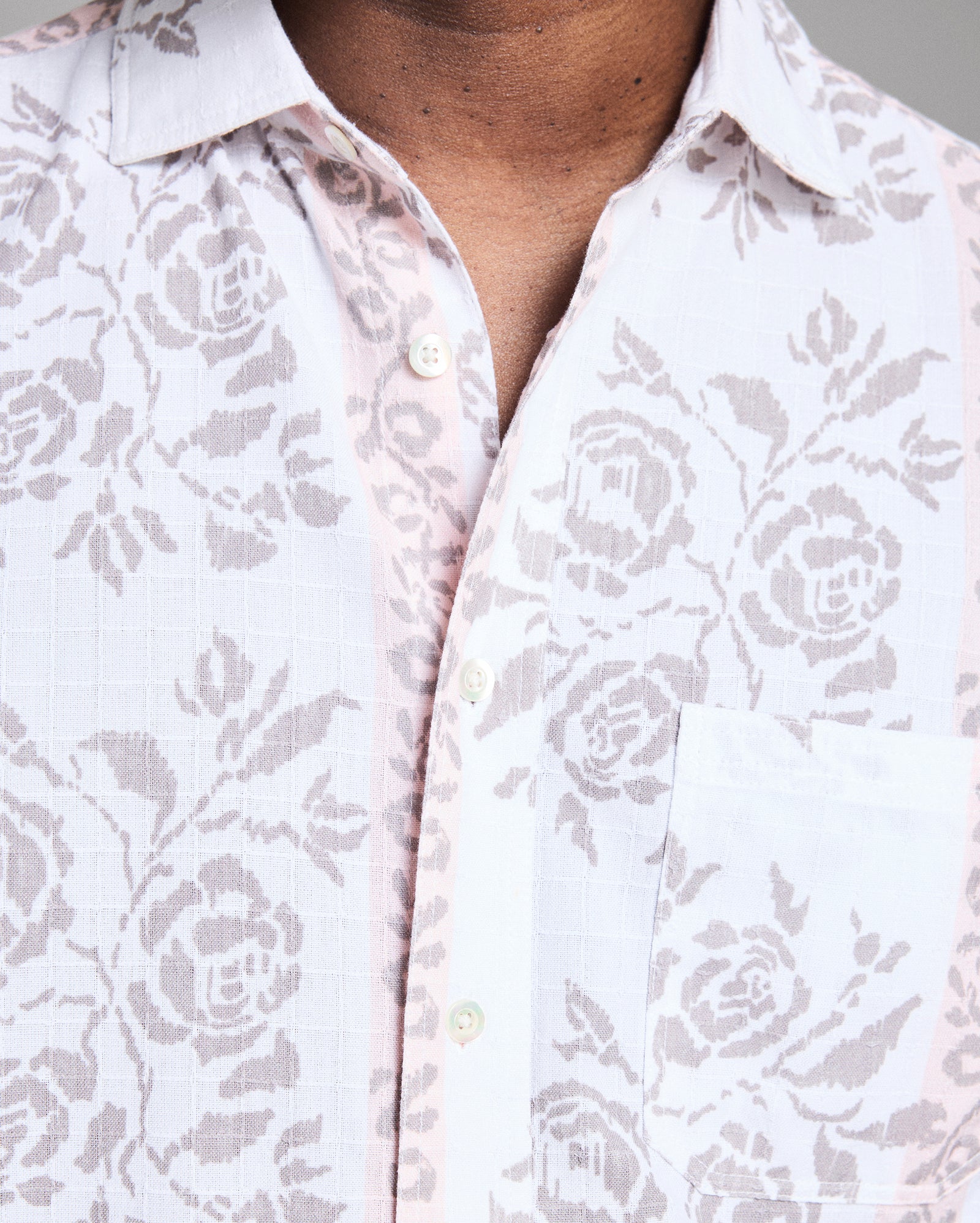 Close-up of a white shirt with floral pattern