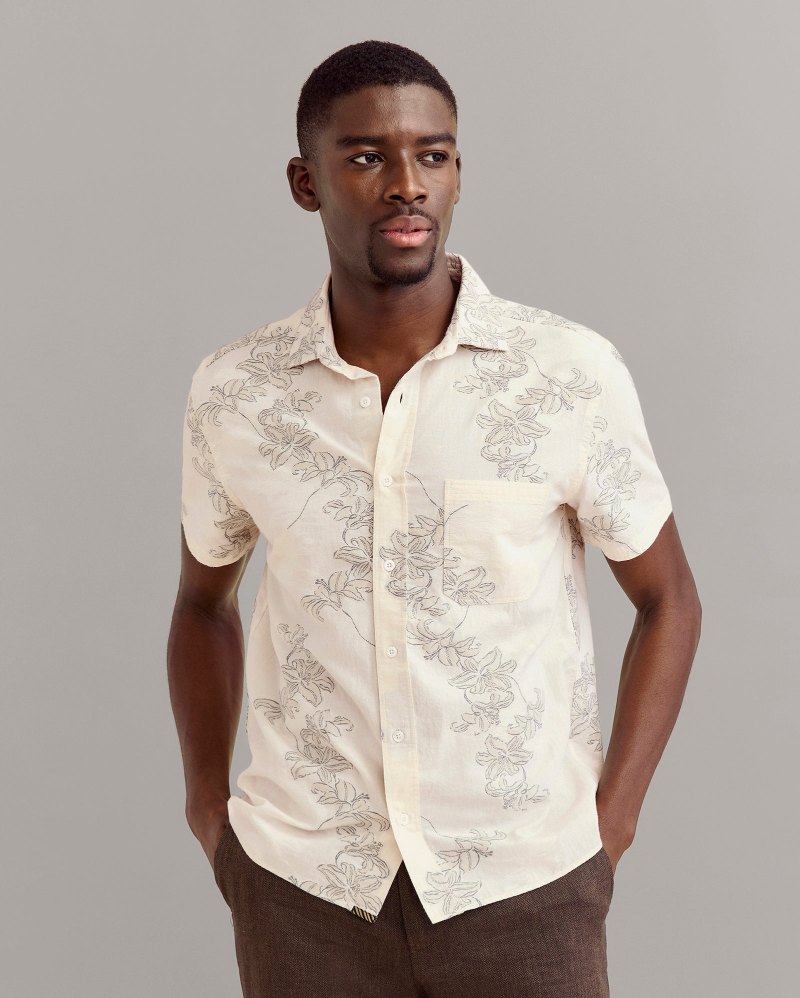 Model wears the Short Sleeve Watercolor Lily Jacquard Treme Shirt in Highway Grey