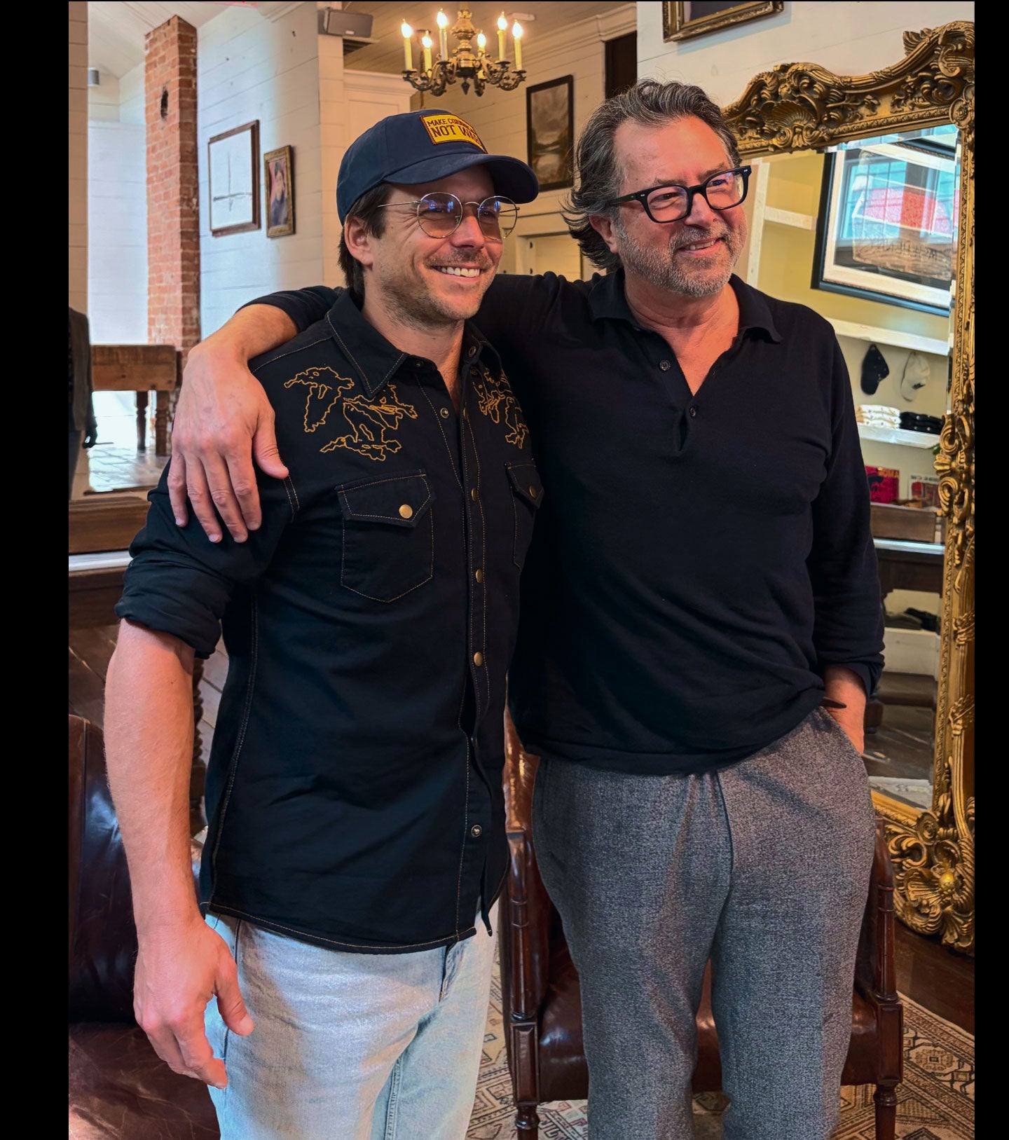 Lukas Nelson and Billy Reid pose for a photo.