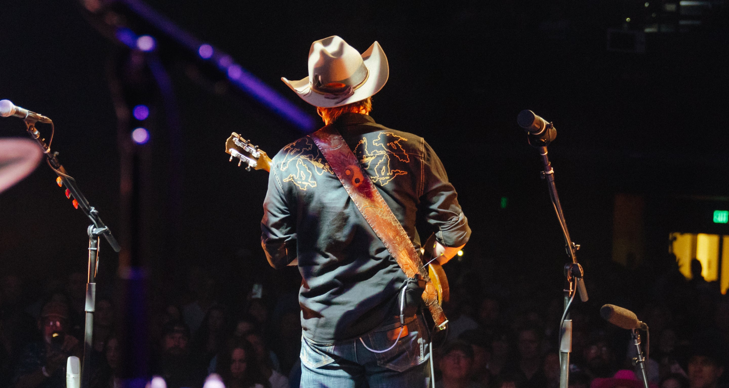 Lukas Nelson plays guitar.