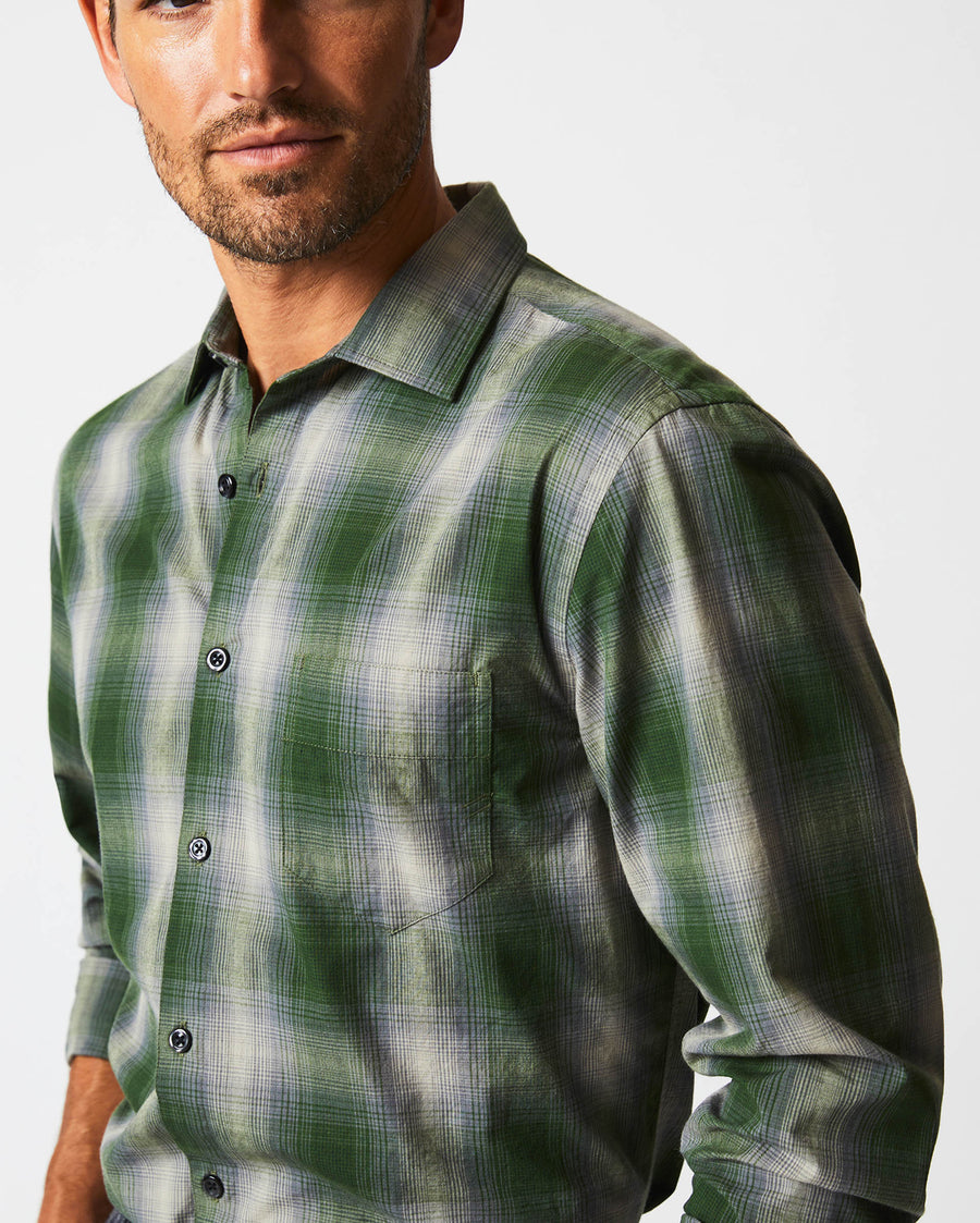Male model wears the Shadow Plaid Tuscumbia Shirt in Green/Grey