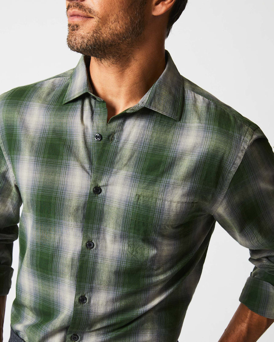 Male model wears the Shadow Plaid Tuscumbia Shirt in Green/Grey