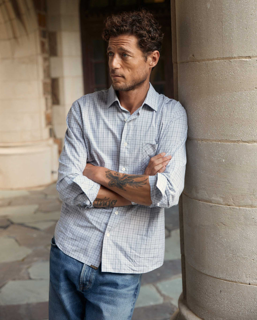 Male model wears the Melange Window Plaid Joh T Shirt in Grey/Multi