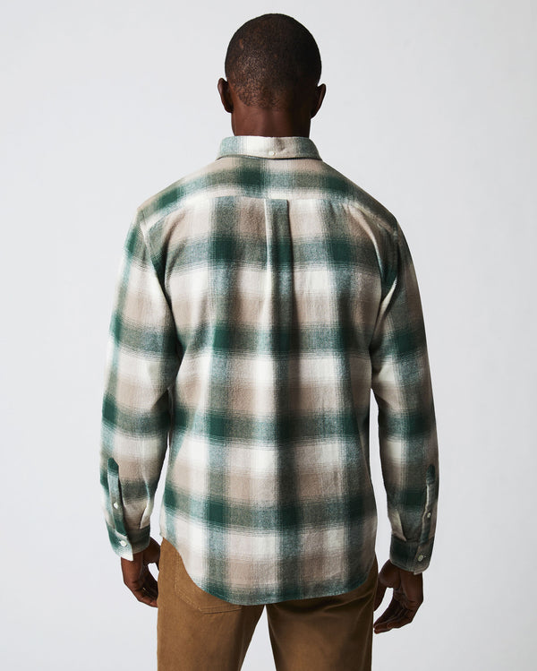 Male model wears the flannel bold plaid tuscumbia shirt button down in natural/green