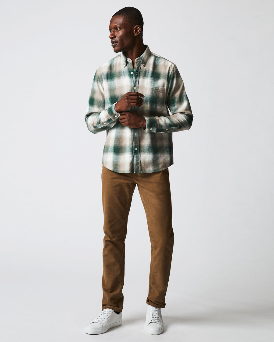 Male model wears the flannel bold plaid tuscumbia shirt button down in natural/green