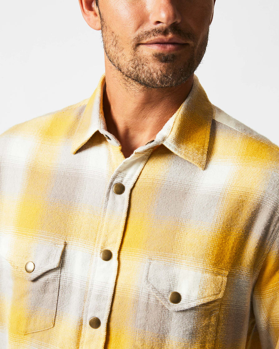 Male model wears the Flannel Bold Plaid Western Snap Front Shirt in Natural/Yellow