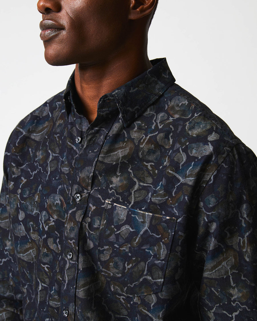 Male model wears the Lowtide MSL 1 Pocket Shirt in Carbon Blue
