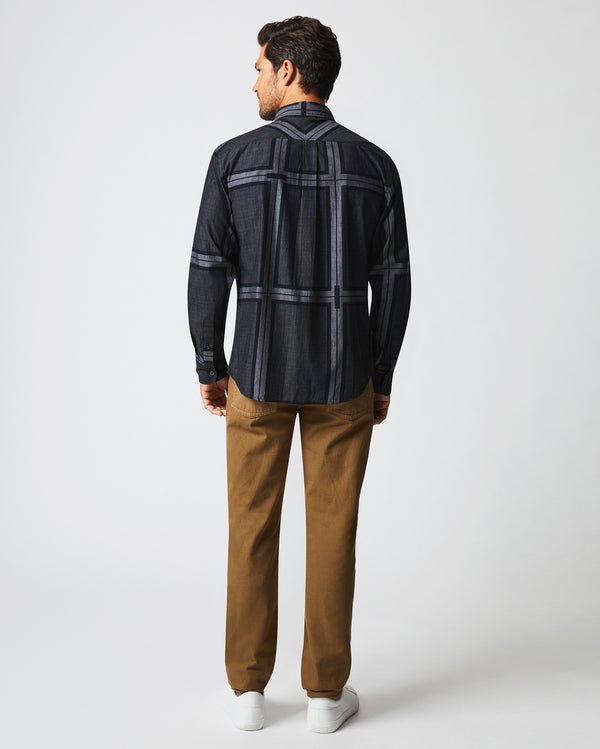 Male model wears the textured plaid MSL 1-Pocket shirt in black/dark brown