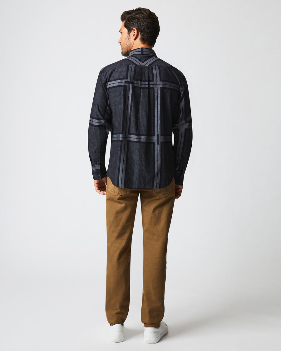 Male model wears the textured plaid MSL 1-Pocket shirt in black/dark brown