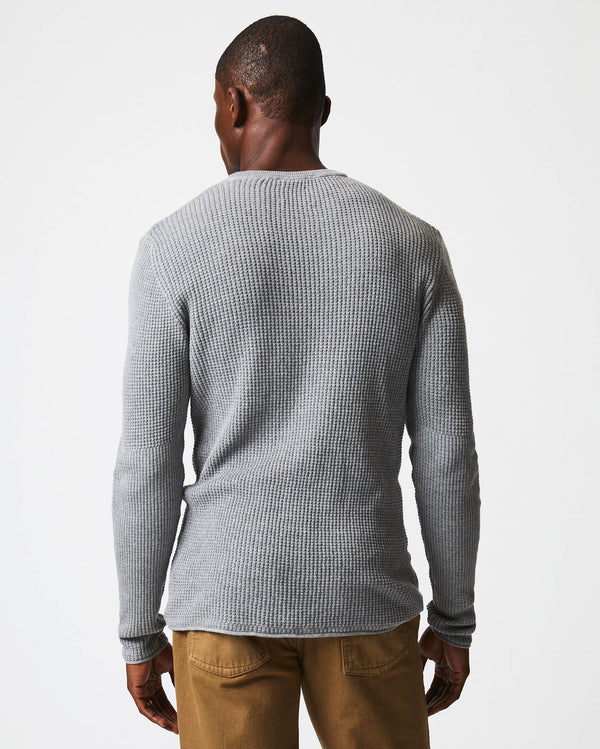 Male model wears the mini waffle crew in grey