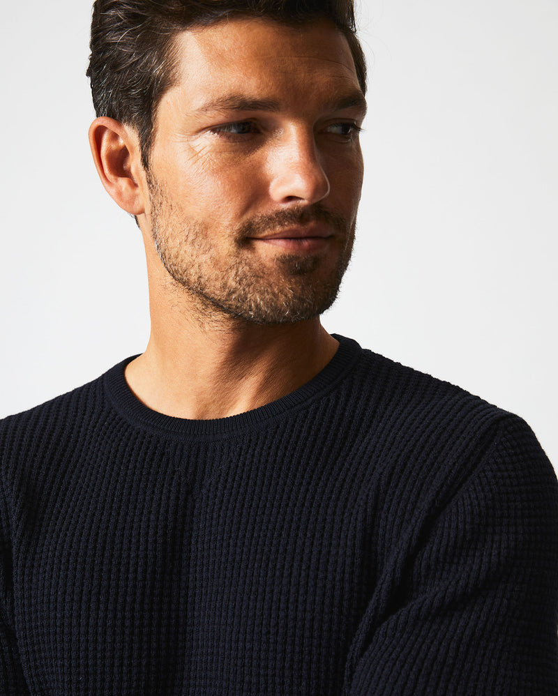Male model wears the Mini Waffle Crew in Midnight