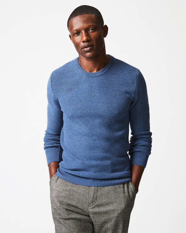 Male model wears the Hunting Sweater in Denim Blue