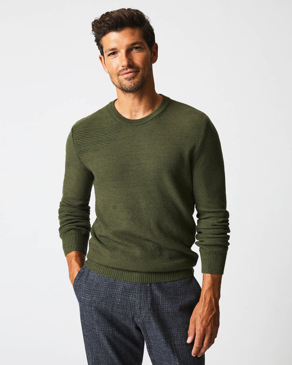 Male model wears the Hunting Sweater in Fern