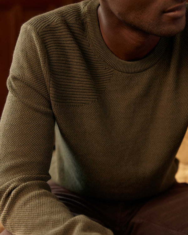 Male model wears the Hunting Sweater in Fern