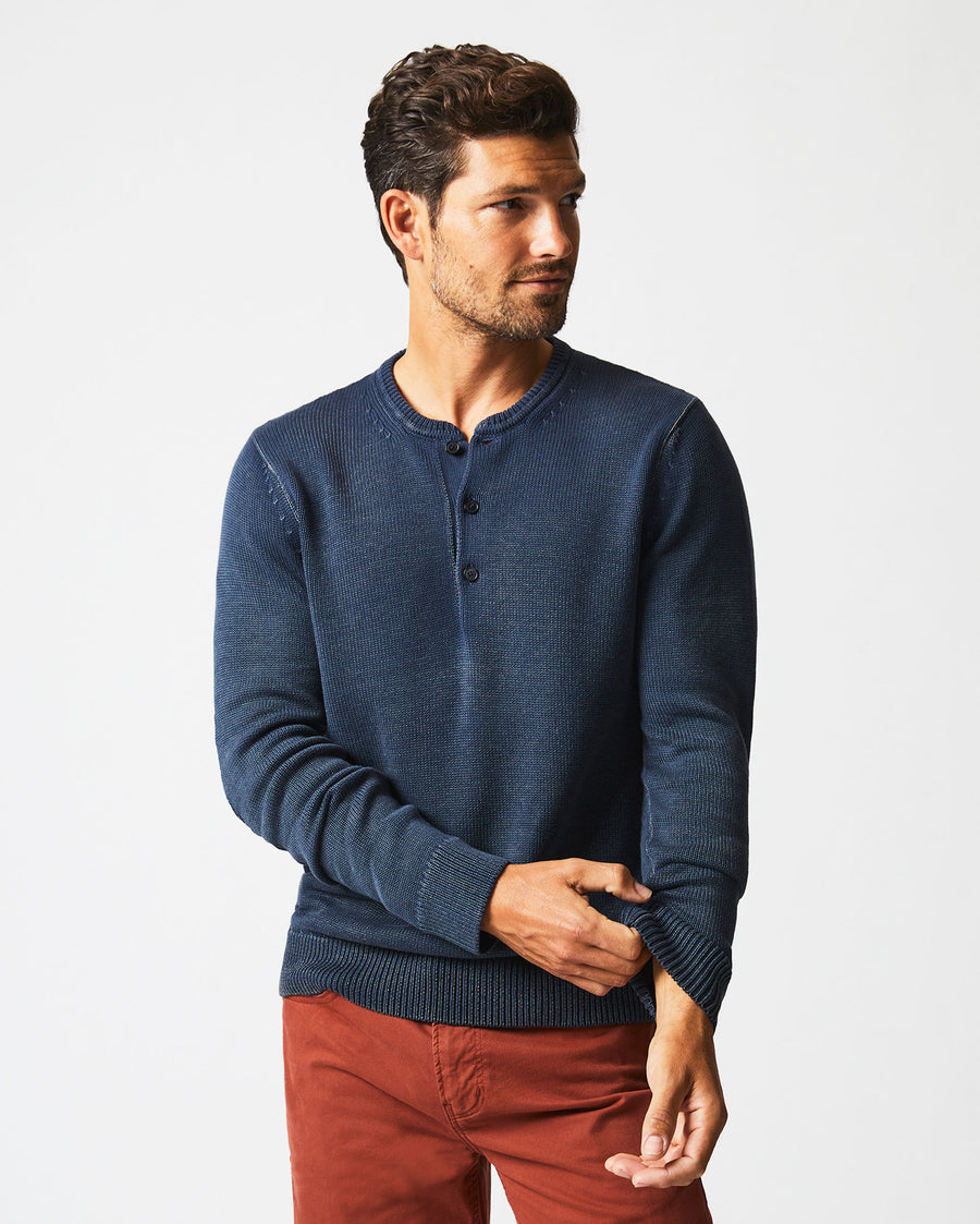 Male model wears the Garment Dyed Henley Sweater in Carbon Blue