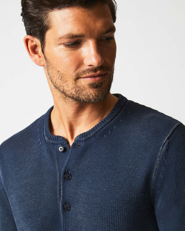Male model wears the Garment Dyed Henley Sweater in Carbon Blue