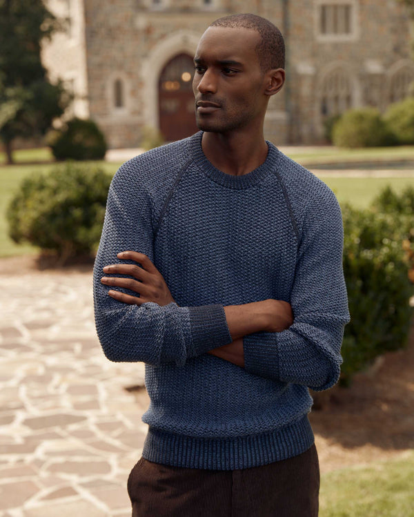 Male model wears the marled crewneck sweater in carbon blue
