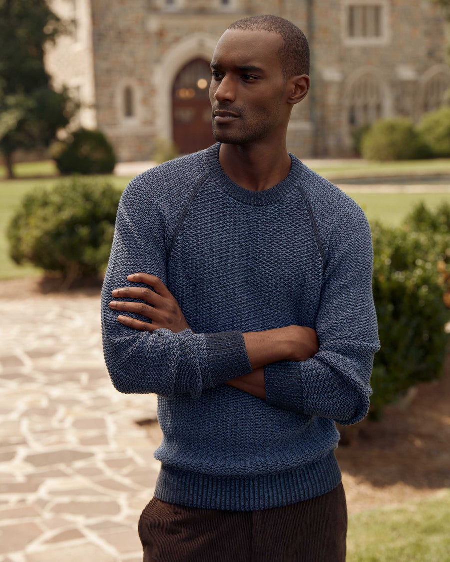 Male model wears the marled crewneck sweater in carbon blue