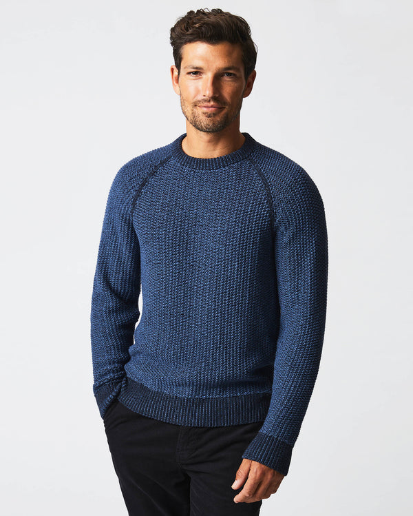 Male model wears the marled crewneck sweater in carbon blue