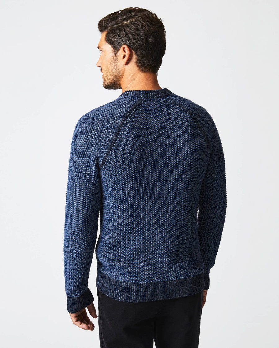 Male model wears the marled crewneck sweater in carbon blue