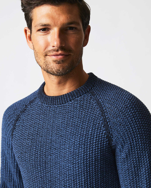 Male model wears the marled crewneck sweater in carbon blue
