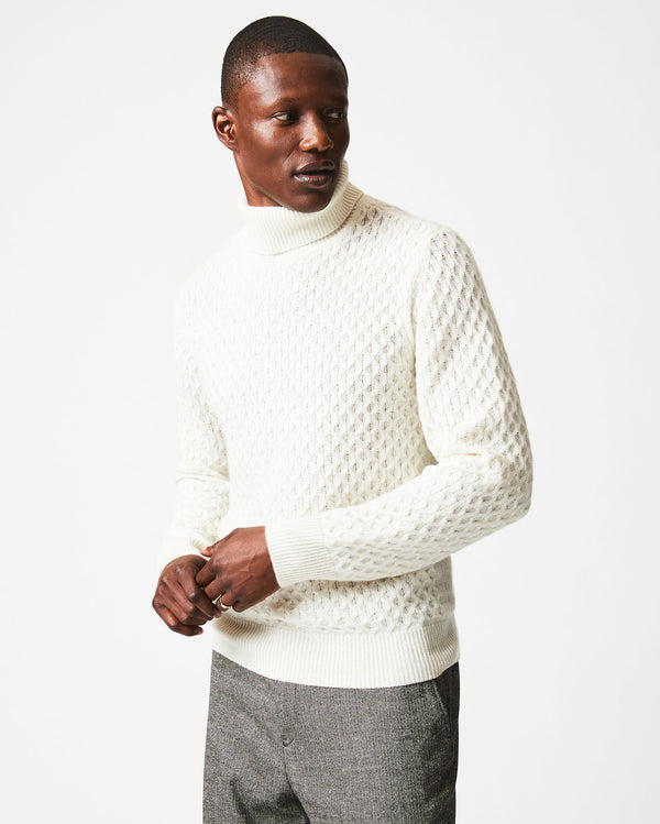 Male model wears the Cashmere Honeycomb Turtleneck in Natural