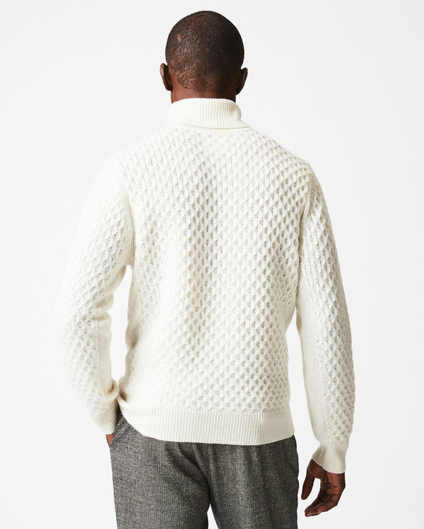 Male model wears the Cashmere Honeycomb Turtleneck in Natural