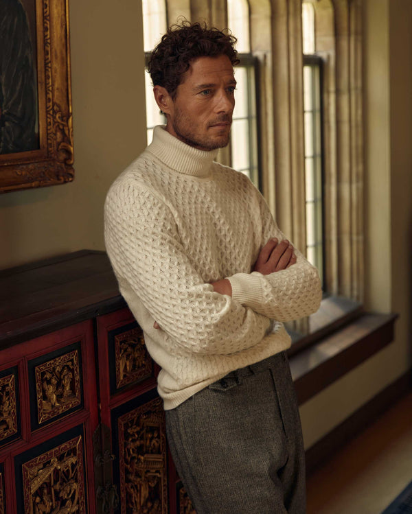 Male model wears the Cashmere Honeycomb Turtleneck in Natural