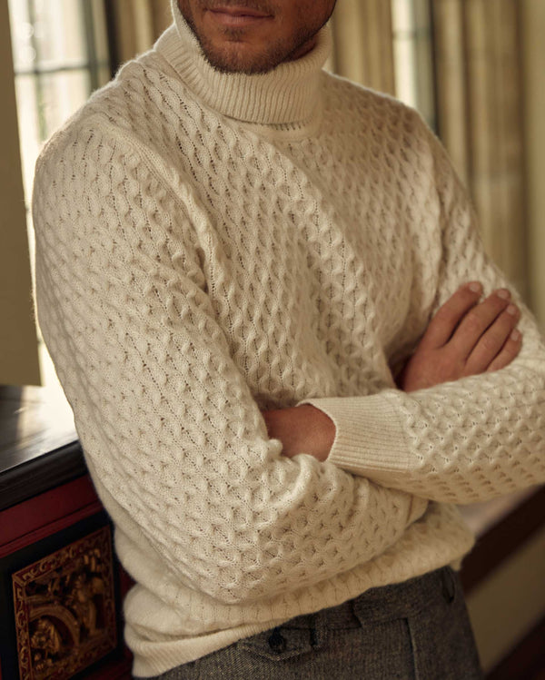 Male model wears the Cashmere Honeycomb Turtleneck in Natural