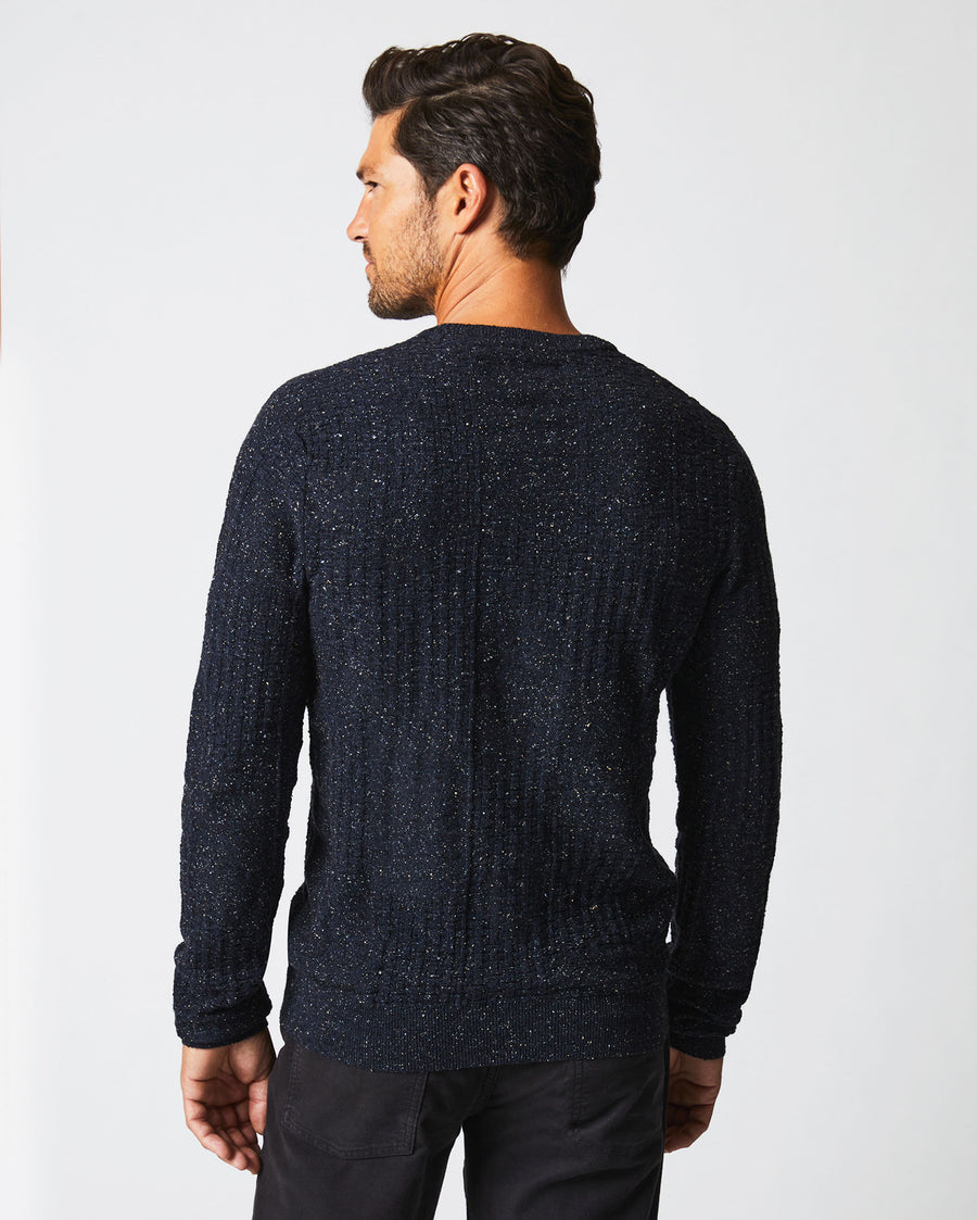 Male model wears the Weave Sweater Crew in Navy Marled