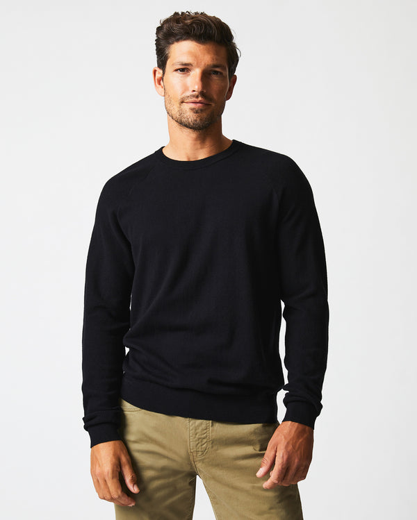 Male model wears the Baseball Sweater Crew in Black