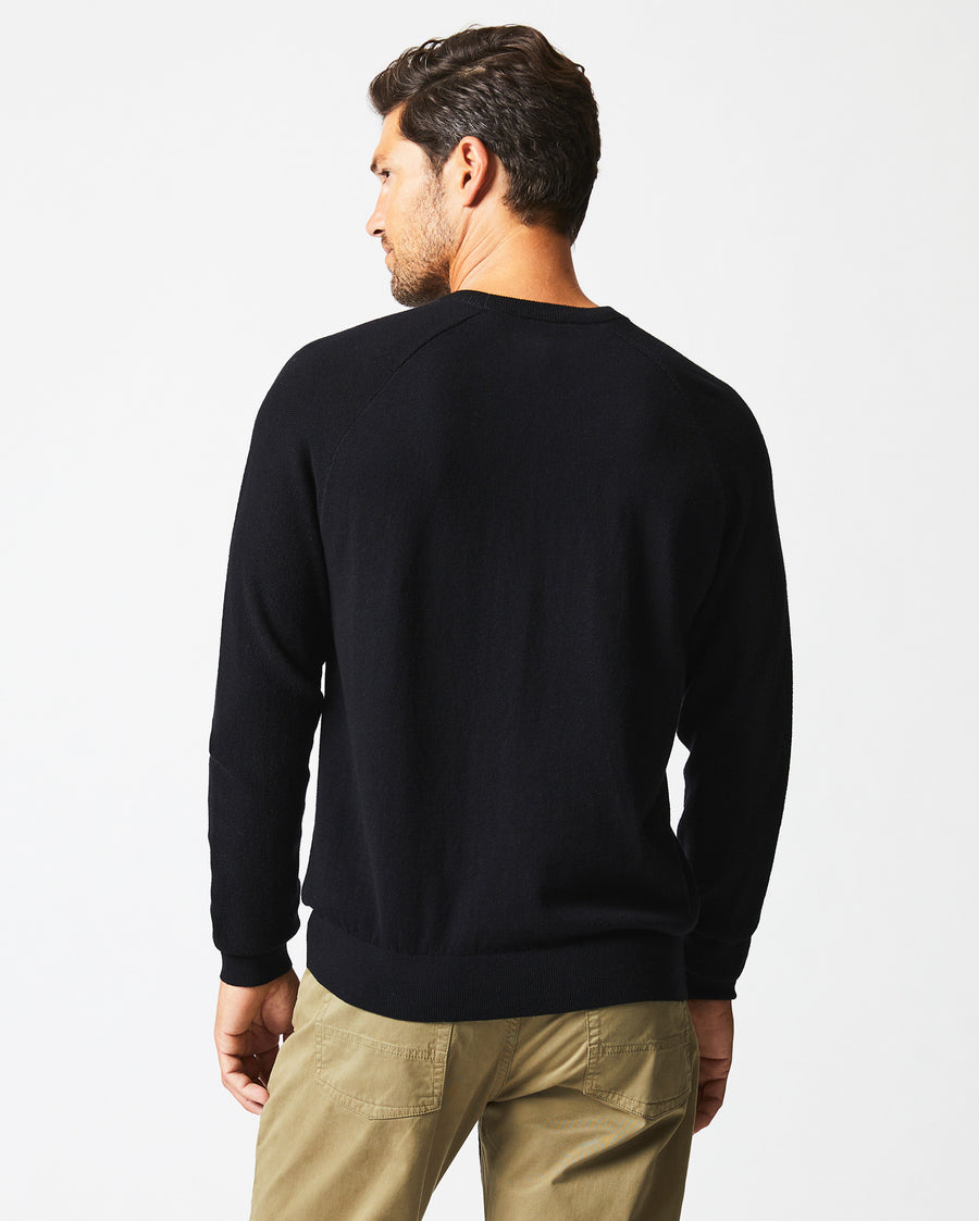 Male model wears the Baseball Sweater Crew in Black