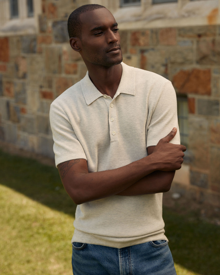 Male model wears the American Pique Sweater Polo in Heathered Grey