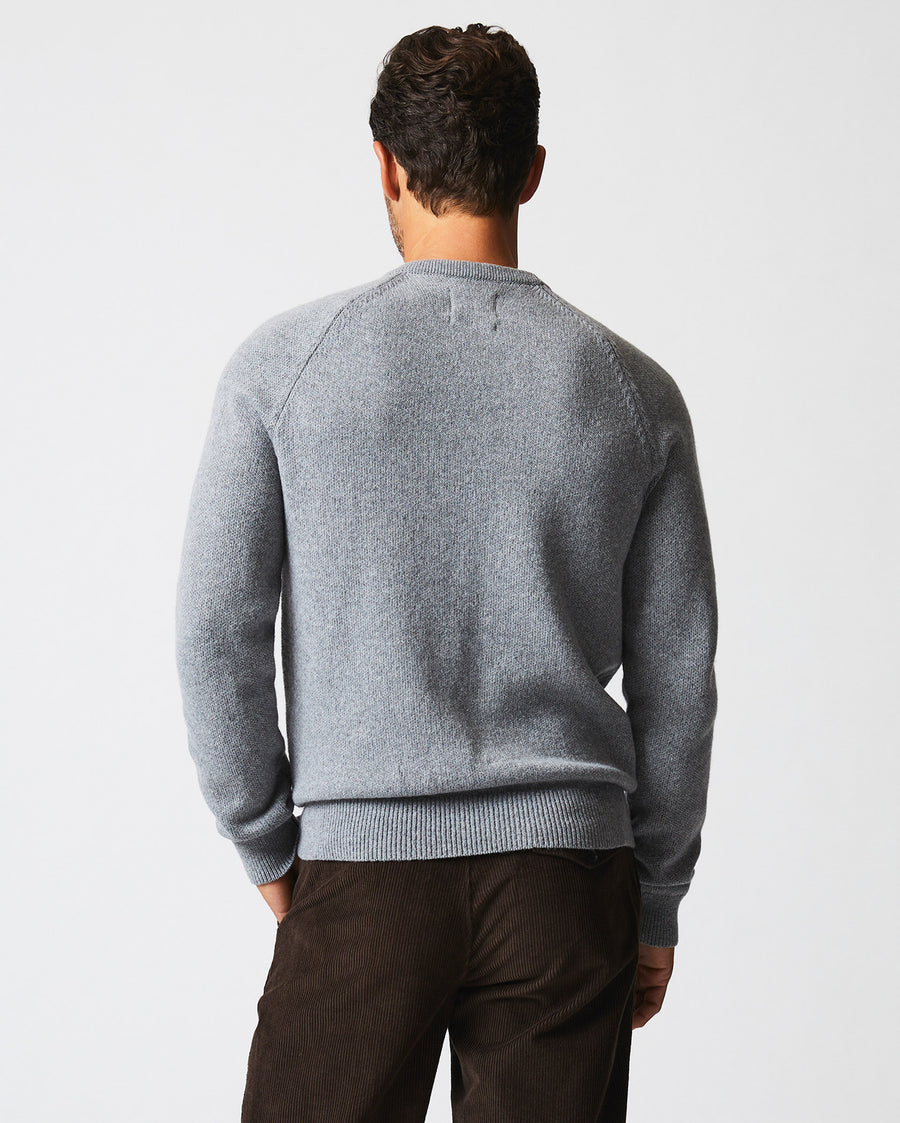 Male model wears the Southern Sweater in Grey