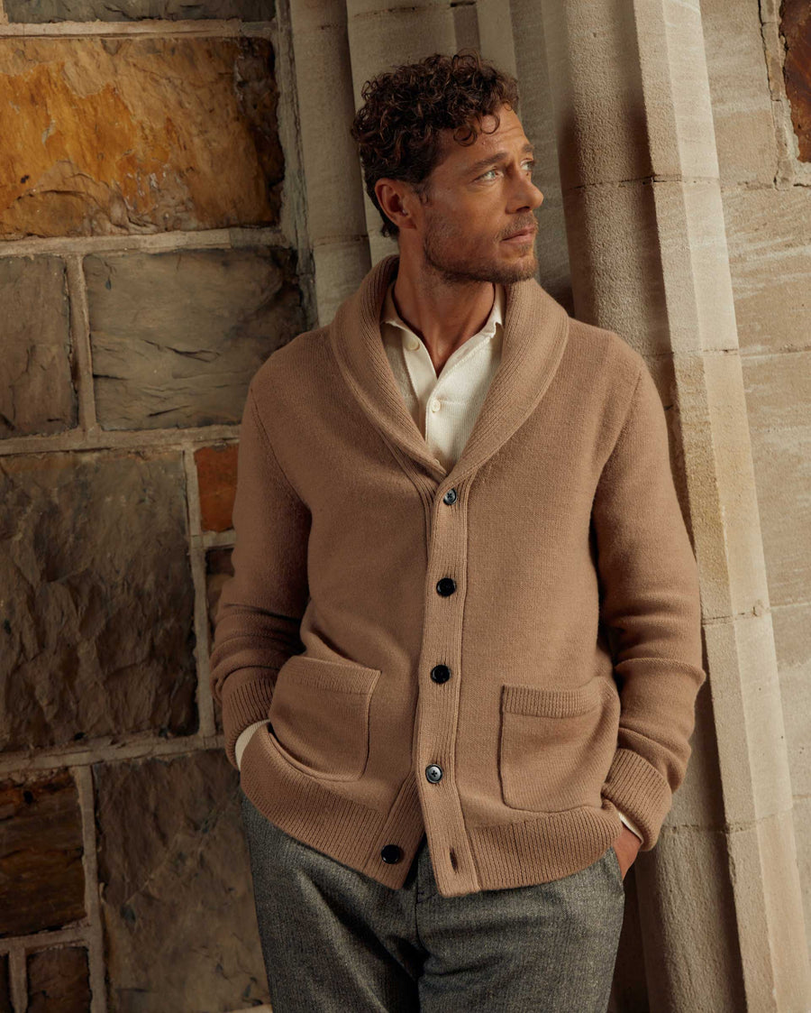 Male model wears the Collegiate Cardigan in Camel/Heather