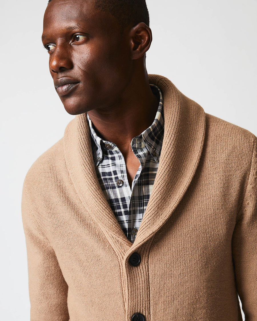 Male model wears the Collegiate Cardigan in Camel/Heather