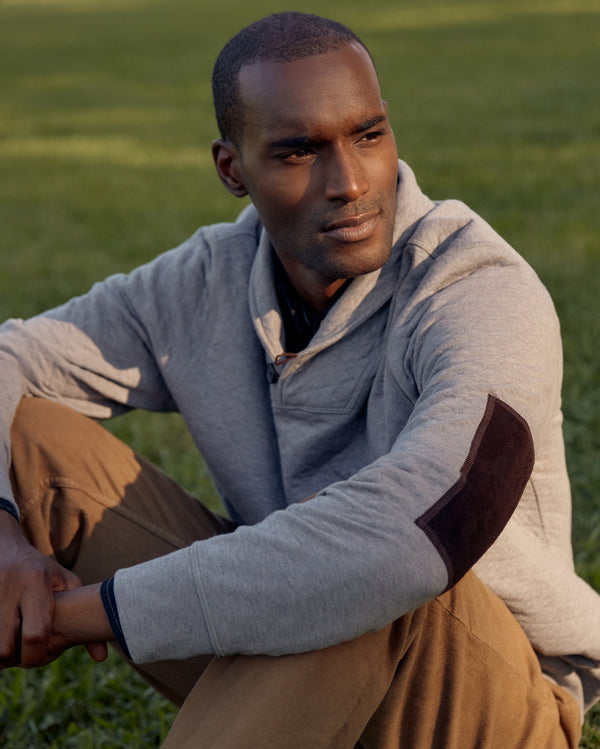 Male model wears the Diamond Quilt Shawl in Medium Grey