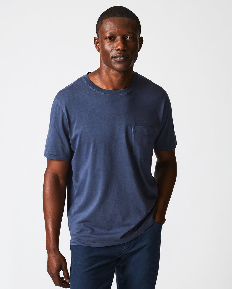 Male model wears the Washed Tee in Navy
