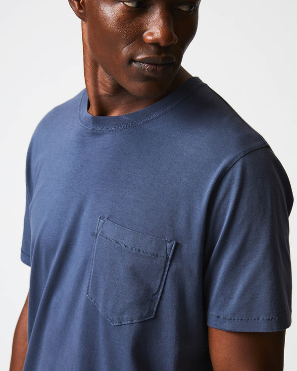 Male model wears the Washed Tee in Navy
