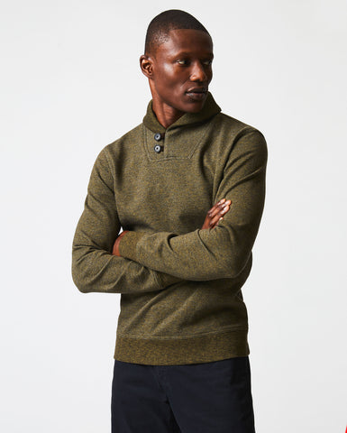Male model wears the Mouline Shawl Pullover in Olive