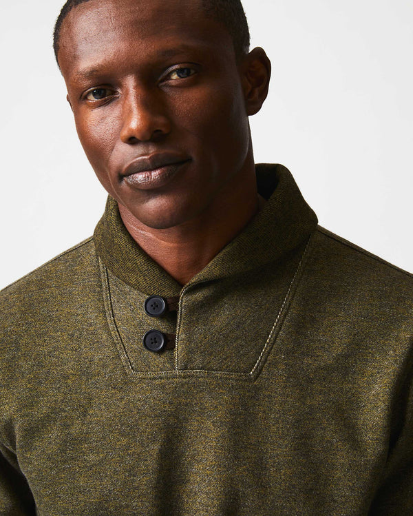 Male model wears the Mouline Shawl Pullover in Olive