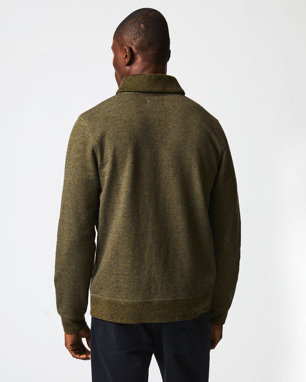 Male model wears the Mouline Shawl Pullover in Olive
