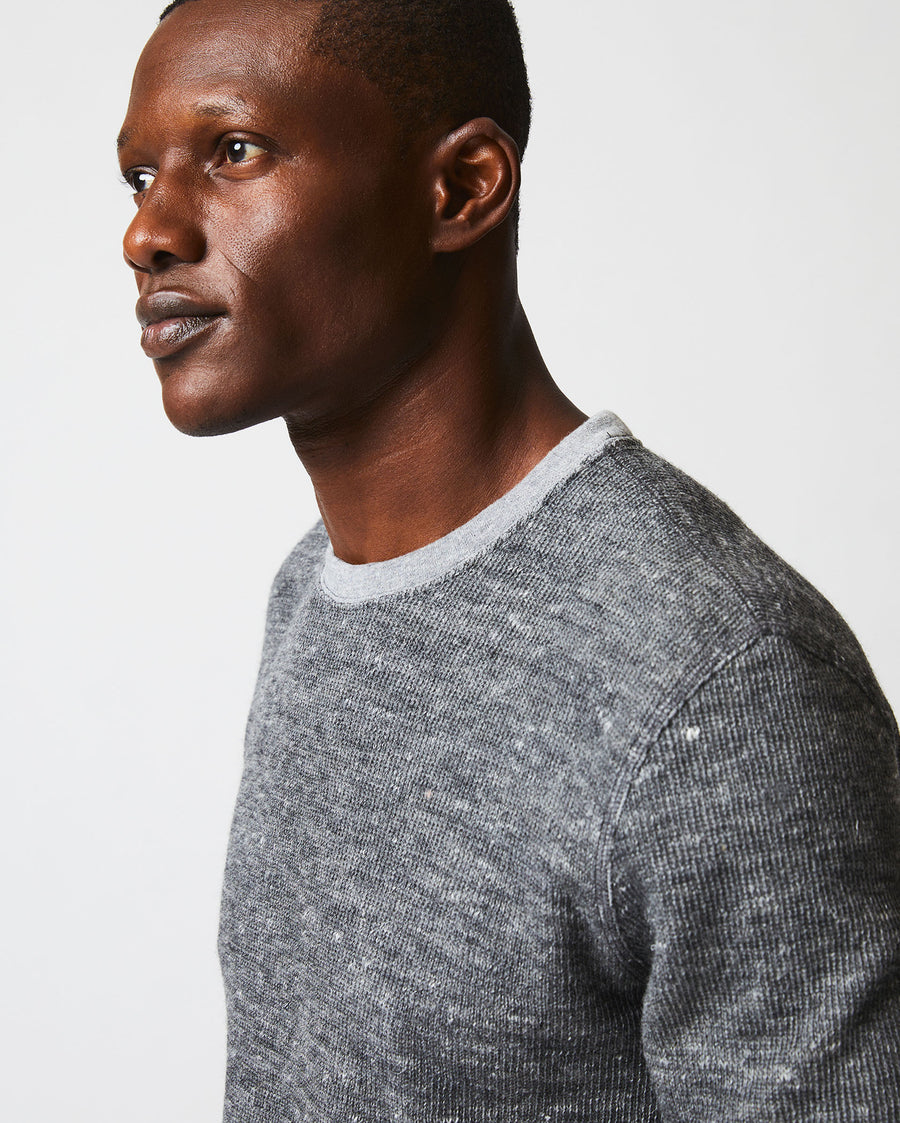 Male model wears the LS Rib Tee in Heather Grey